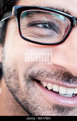 Man with glasses smiling, close-up. Stock Photo