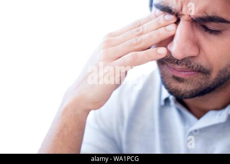 Man rubbing his right eye. Stock Photo