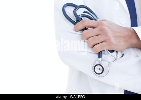 Doctor holding stethoscope, close-up. Stock Photo