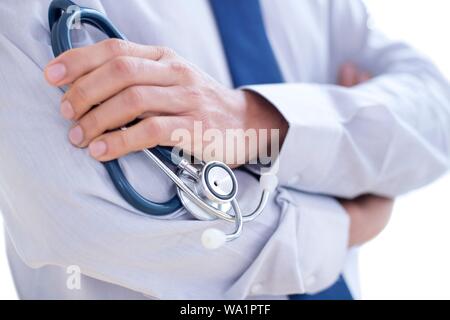 Doctor holding stethoscope, close-up. Stock Photo