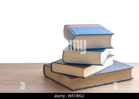 Book stack or pile of book on wooden table in white background with clipping path, back to school concept. Stock Photo