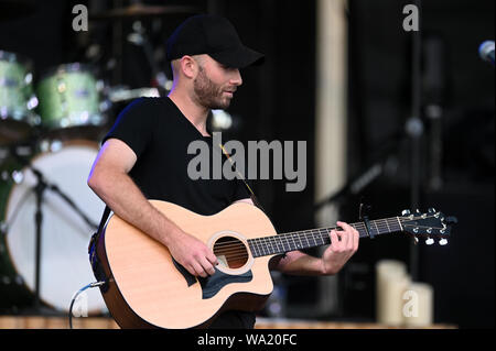 AUG 15, 2019 : Scott Gagne performs with Cassidy Daniels as the warmup act to Billy Currington during a summer concert held at The Freeman Stage in Selbyville, DE. Stock Photo