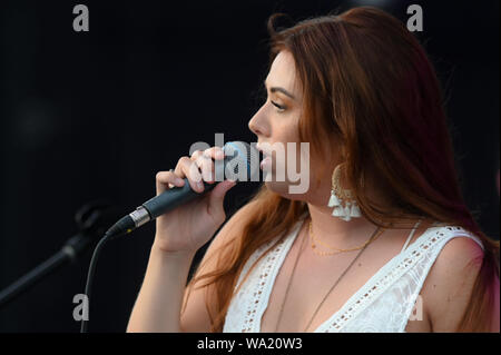 AUG 15, 2019 : Cassidy Daniels performs as the warmup act to Billy Currington during a summer concert held at The Freeman Stage in Selbyville, DE. Stock Photo