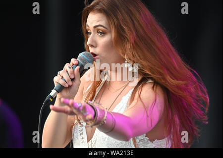 AUG 15, 2019 : Cassidy Daniels performs as the warmup act to Billy Currington during a summer concert held at The Freeman Stage in Selbyville, DE. Stock Photo