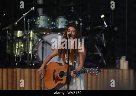 AUG 15, 2019 : Cassidy Daniels performs as the warmup act to Billy Currington during a summer concert held at The Freeman Stage in Selbyville, DE. Stock Photo