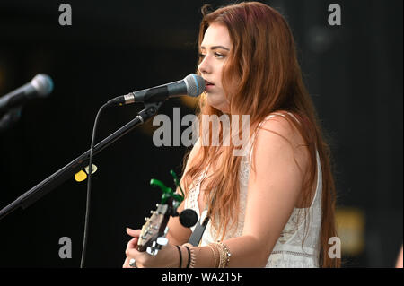 AUG 15, 2019 : Cassidy Daniels performs as the warmup act to Billy Currington during a summer concert held at The Freeman Stage in Selbyville, DE. Stock Photo