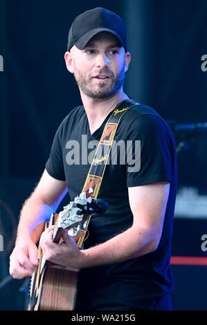 AUG 15, 2019 : Scott Gagne performs with Cassidy Daniels as the warmup act to Billy Currington during a summer concert held at The Freeman Stage in Selbyville, DE. Stock Photo