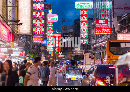 Bangkok, Thailand - June 5, 2019: night Yaowarat Road (Chinatown) with Chinese signboards, the street traffic, and walking crowd. Stock Photo