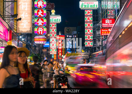 Bangkok, Thailand - June 5, 2019: colorful night lights in Yaowarat Road, the street traffic and people (both blurred in long exposure). Stock Photo