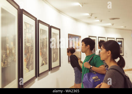 Bangkok, Thailand - June 16, 2019: young Thai people view artworks at an exhibition in Bangkok Art and Culture Center. Stock Photo