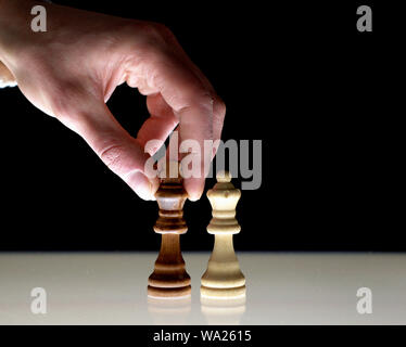 Chess embossed on a piece, controlled by a hands calculated action