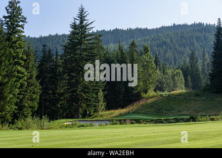 WHISTLER, BC/CANADA – AUGUST 3, 2019: Fairmont Chateau Whistler Golf Club morning fairway and green. Stock Photo