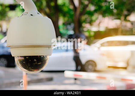 Close-up CCTV monitoring, security cameras at outdoor car parking. Stock Photo