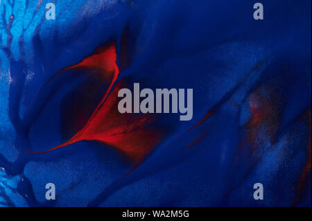 Real blue paint background with red stroke close up view Stock Photo