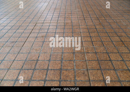 Floor tiles brown vignette can be used as background or for interior design and exterior. Stock Photo