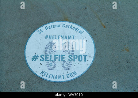 A selfie spot indicator painted on the side walk outside of the Cathedral of St. Helena, Helena, Montana, USA. Stock Photo