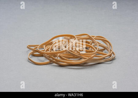 Rubber bands on grey background.