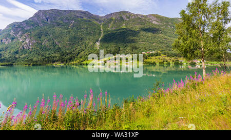 Mountain panorama with mountain Eggenipa reflecting in a lake in Gloppen along highway E39 in Sogn og Fjorden county in Norway Stock Photo