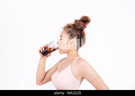 Portrait of  fitness sport girl in fashion sportswear drinking cola Stock Photo