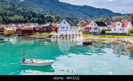View at Solvorn, a picturesque little village with white wooden houses along Lustrafjorden on a summer day in Sogn og Fjordane county in Norway. Stock Photo