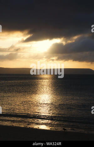 Sunrise over the ocean in Weymouth Beach Dorset Stock Photo