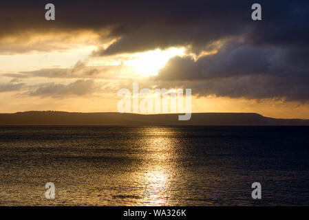 Sunrise over the ocean in Weymouth Beach Dorset Stock Photo