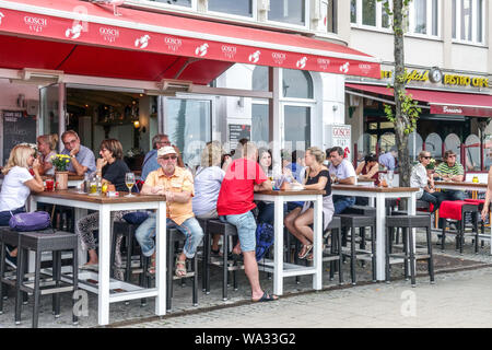 Warnemunde tourists in the bar on the promenade, Alter Strom, Rostock Germany Stock Photo