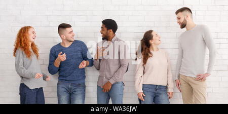 Friendly students talking, having break at college Stock Photo