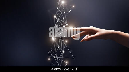 Woman finger touching 3D network with points on blue Stock Photo
