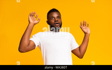 Emotional surprised bearded man standing with open mouth Stock Photo