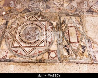 Particular of the polychrome opus sectile of the room with the three-light window in the Domus of Ninfeo located archaeological excavations of Ostia A Stock Photo