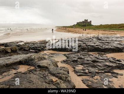 Bamburgh Castle from Harkess Rocks, Bamburgh, Northumberland, England, UK Stock Photo