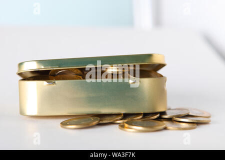 Money box with Indian coins Stock Photo