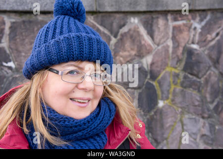 portrait of a smiling confident blonde Caucasian woman in her fifties Stock Photo