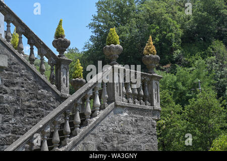 Staircase with stone columns and plant pots at the corners, typical historical garden design in Bagnone, a beautiful city in Lunigiana, Tuscany, Italy Stock Photo