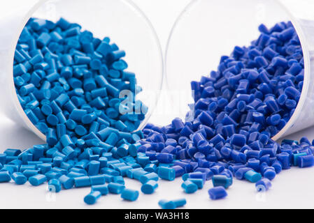 2 different dyed blue plastic granulates in lab Stock Photo
