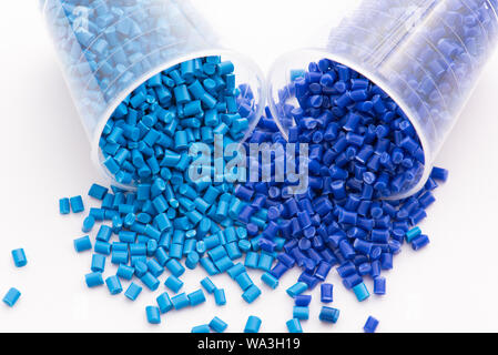 2 different dyed blue plastic granulates in lab Stock Photo