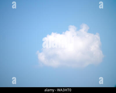 Perfect puffy white cloud on blue summer sky.