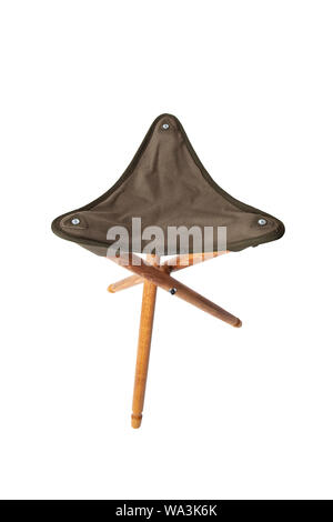 Folding wooden hunting stool tripod isolate on white background. Three-legged camping chair. Stock Photo