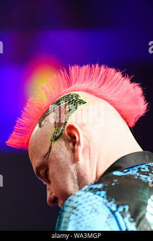 Michael van Gerwen prepares to throw during the BetMGM Premier League ...