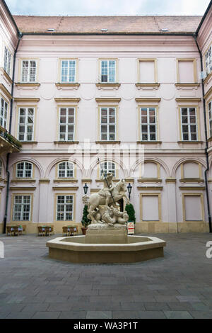 Ornate fountain of St George slaying the dragon in the ancient city of Bratislava, Slovakia Stock Photo