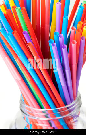 A background of colorful plastic straws used to illustrate plastic pollution Stock Photo