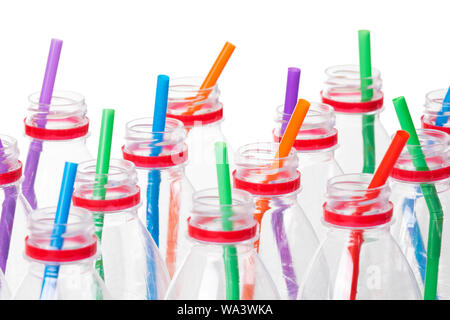 A collection of clear plastic bottles with straws  isolated on a white background Stock Photo