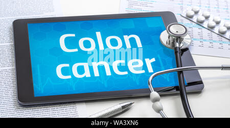 The word Colon cancer on the display of a tablet Stock Photo