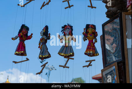 Kathmandu, Nepal-November 02,2017: traditional asian puppet on a string is hanging in a gift shop in Kathmandu Stock Photo