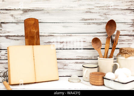 An English cake in a baking dish on a wooden board and a white wooden  table. Selective focus Stock Photo - Alamy