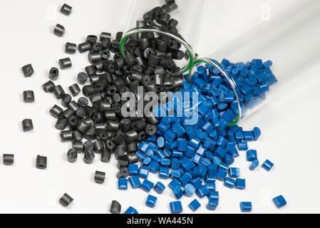 black and blue polymer pellets in test tubes in laboratory Stock Photo