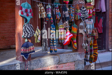 typical Nepalese knitted  caps and socks on a market stall in Kathmandu Stock Photo