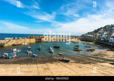 Small fishing boats in Mousehole harbour Cornwall England GB UK EU Europe Stock Photo