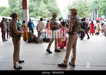 (190817) -- BANGALORE, Aug. 17, 2019 (Xinhua) -- Indian paramilitary soldiers stand guard outside a train station in Bangalore, India, Aug. 17, 2019. Bangalore, capital of India's southwestern state Karnataka, has been on high security alert with armed police deployed across the city on Saturday. The alert followed an advisory note from the City Police Commissioner Bhaskar Rao to his deputies to intensify security at all iconic installations and public places in the city. (Str/Xinhua) Stock Photo